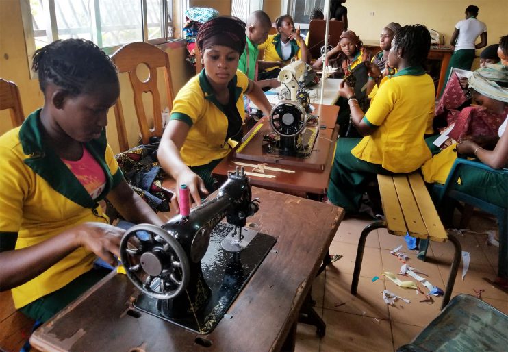 Girls learning to sewing